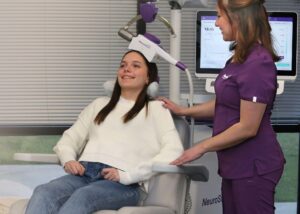 Clinician checking in warmly with a patient mid-session, reflecting how to help someone with depression without pushing them